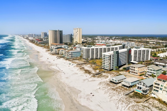 birds eye view of property with a city view, a view of the beach, and a water view