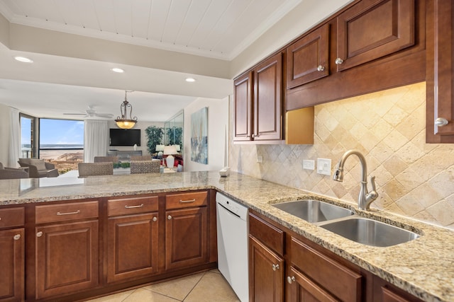 kitchen with tasteful backsplash, ornamental molding, light stone counters, white dishwasher, and a sink