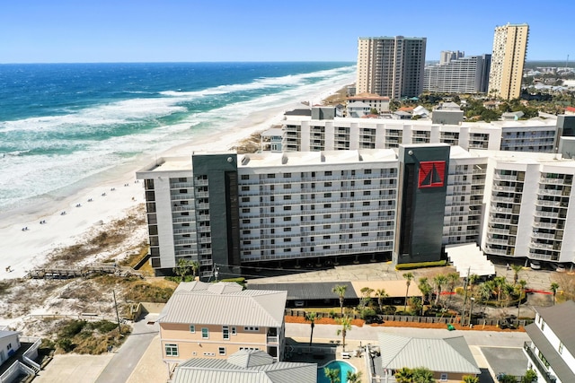 aerial view with a water view, a city view, and a beach view