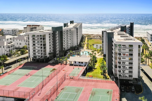 birds eye view of property featuring a view of the beach and a water view