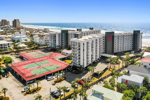 birds eye view of property with a water view and a city view