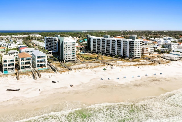 aerial view featuring a view of city, a water view, and a view of the beach