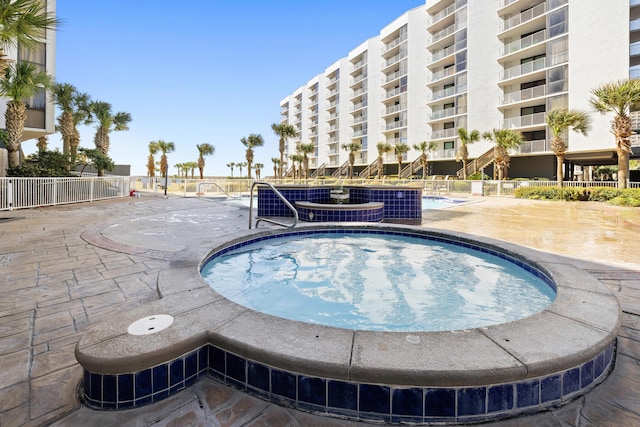 view of swimming pool with fence