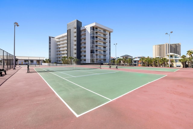 view of sport court with fence