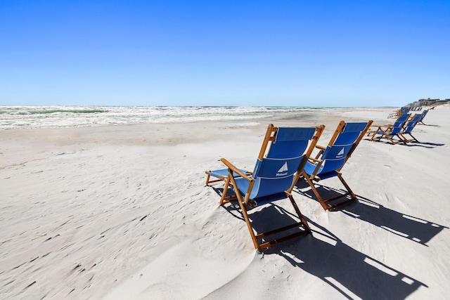 view of property's community with a view of the beach and a water view