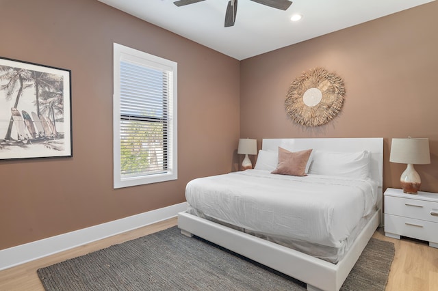 bedroom featuring ceiling fan, baseboards, light wood-style flooring, and recessed lighting