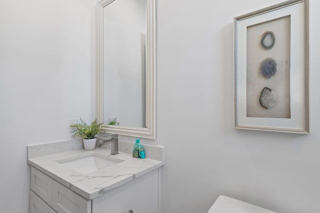 half bath with toilet and vanity