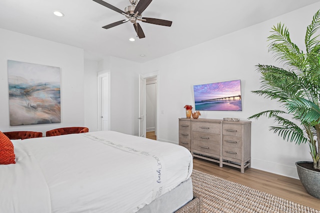 bedroom featuring recessed lighting, baseboards, wood finished floors, and ceiling fan