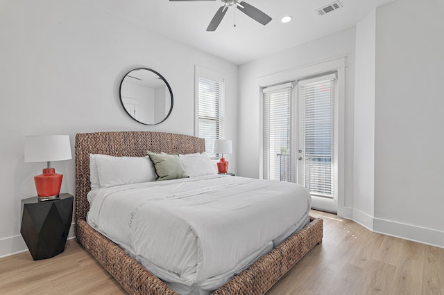 bedroom featuring access to outside, baseboards, visible vents, and light wood-type flooring