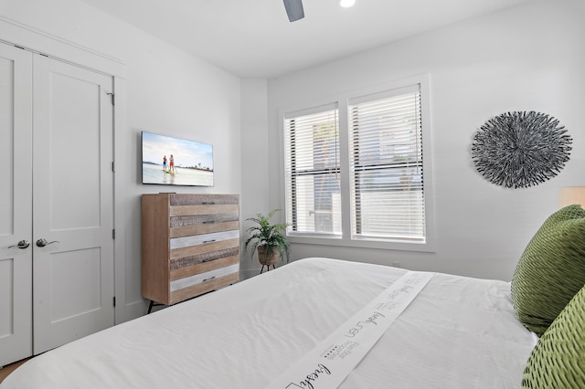 bedroom with a ceiling fan and a closet