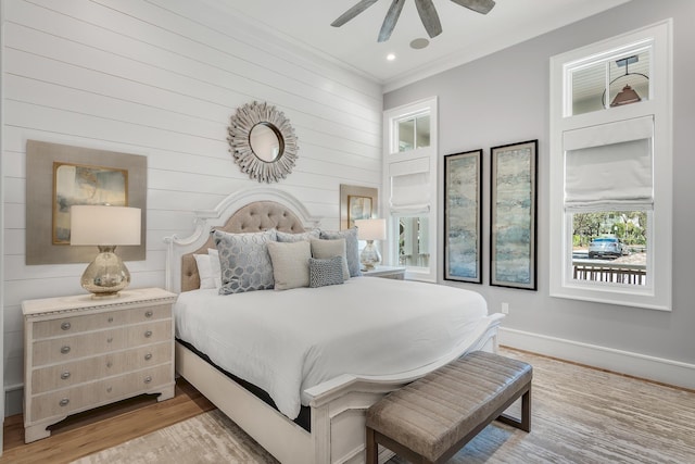 bedroom with light wood-style flooring, ornamental molding, recessed lighting, baseboards, and ceiling fan