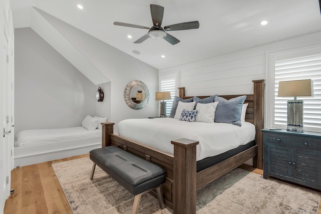 bedroom with recessed lighting, light wood-style flooring, lofted ceiling, and a ceiling fan