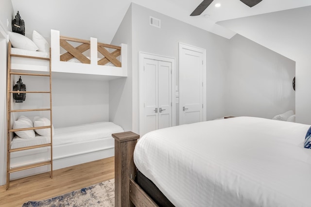 bedroom featuring a ceiling fan, visible vents, wood finished floors, recessed lighting, and a closet