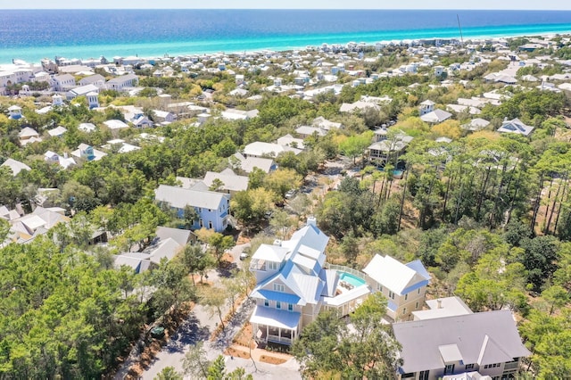 birds eye view of property with a view of the beach, a water view, and a residential view