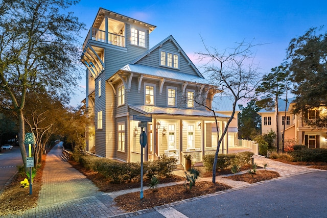 11 Dandelion Dr, Santa Rosa Beach, FL 32459 - traditional style home with covered porch, metal roof, and a balcony