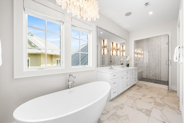 11 Dandelion Dr, Santa Rosa Beach, FL 32459 - full bathroom with a stall shower, a freestanding bath, double vanity, marble finish flooring, and a chandelier