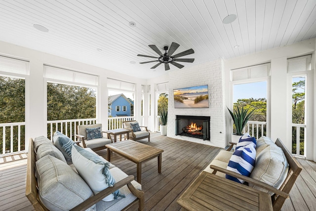 11 Dandelion Dr, Santa Rosa Beach, FL 32459 - sunroom / solarium with an outdoor living space with a fireplace and ceiling fan