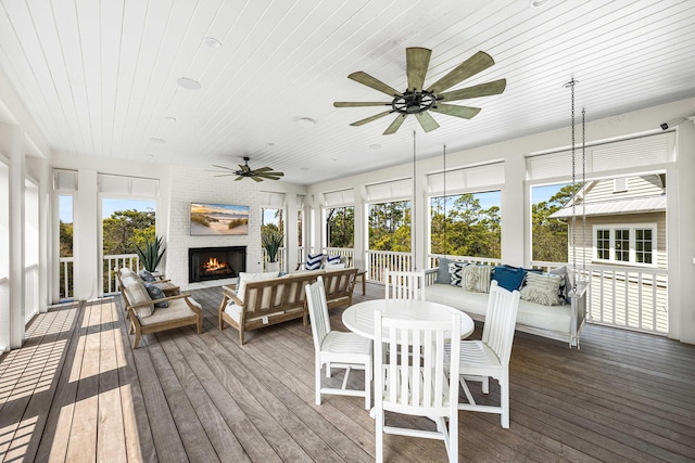11 Dandelion Dr, Santa Rosa Beach, FL 32459 - sunroom / solarium featuring an outdoor living space with a fireplace and a ceiling fan