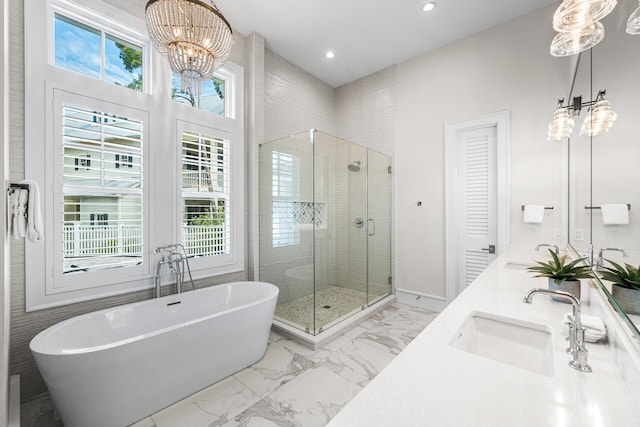 11 Dandelion Dr, Santa Rosa Beach, FL 32459 - bathroom featuring a chandelier, a shower stall, a soaking tub, marble look tiles, and recessed lighting