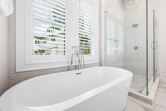 11 Dandelion Dr, Santa Rosa Beach, FL 32459 - bathroom featuring a stall shower, a freestanding tub, and marble look tile flooring