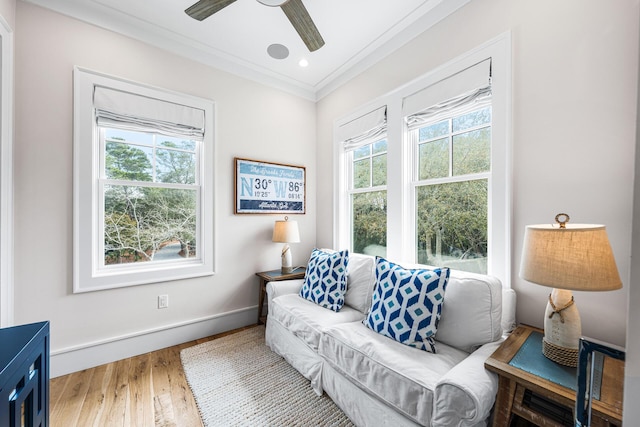 11 Dandelion Dr, Santa Rosa Beach, FL 32459 - living area with crown molding, a ceiling fan, wood finished floors, and baseboards