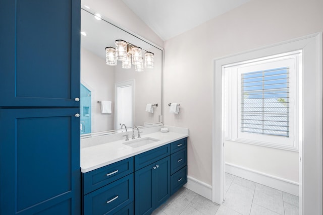 11 Dandelion Dr, Santa Rosa Beach, FL 32459 - bathroom with vaulted ceiling, vanity, tile patterned floors, and baseboards