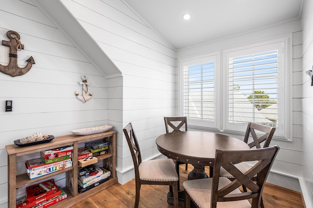 11 Dandelion Dr, Santa Rosa Beach, FL 32459 - dining space with vaulted ceiling, wood finished floors, wooden walls, and recessed lighting