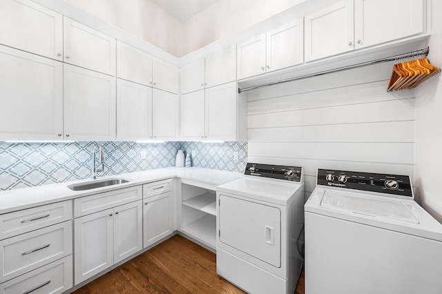 11 Dandelion Dr, Santa Rosa Beach, FL 32459 - laundry room featuring washer and clothes dryer, cabinet space, and dark wood-type flooring