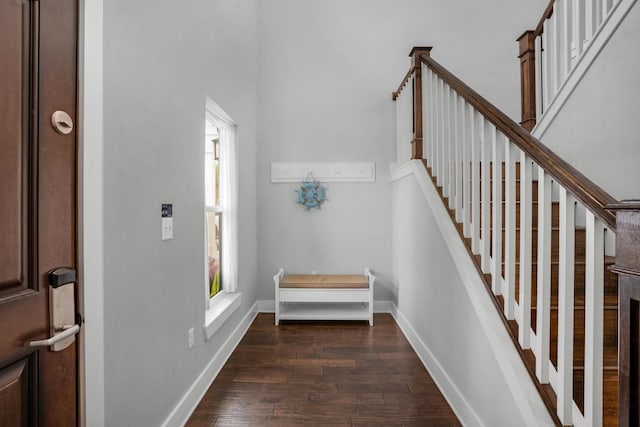 stairs with baseboards and wood finished floors