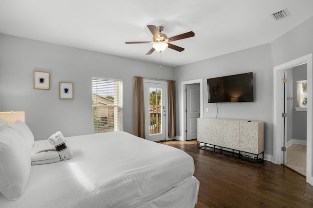 bedroom with visible vents, dark wood-type flooring, baseboards, a ceiling fan, and access to outside