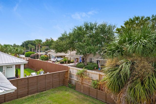 view of yard with a fenced backyard