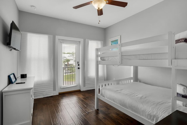 bedroom featuring access to exterior, a ceiling fan, and wood-type flooring