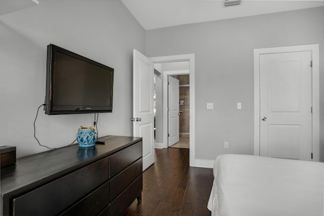 bedroom featuring dark wood finished floors, visible vents, and baseboards