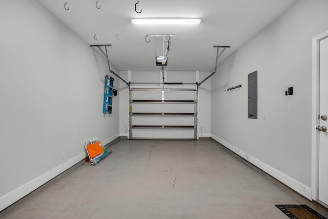 garage with electric panel, baseboards, and a garage door opener