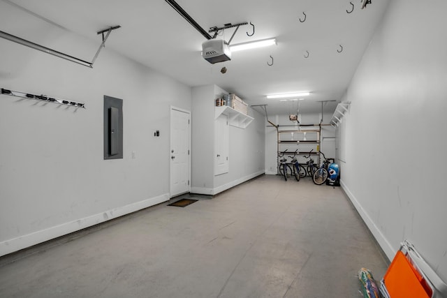 garage with electric panel, baseboards, and a garage door opener