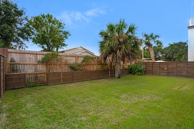 view of yard featuring a fenced backyard