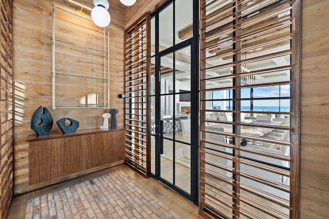 wine cellar with wood walls and wood finished floors