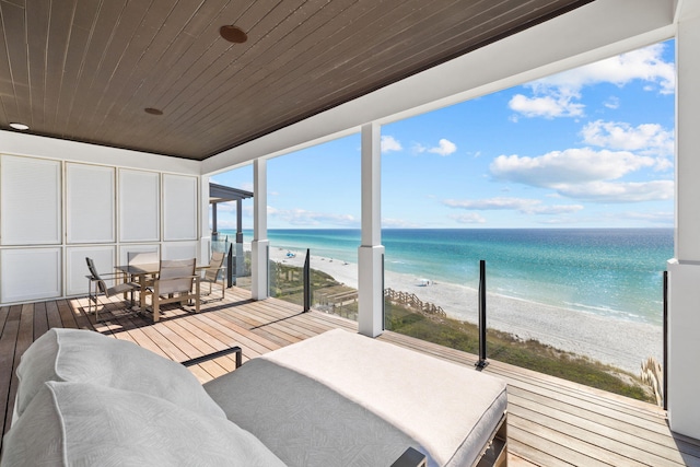 interior space featuring a beach view and a water view