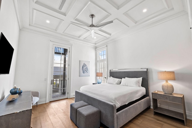 bedroom with access to exterior, light wood finished floors, crown molding, and coffered ceiling