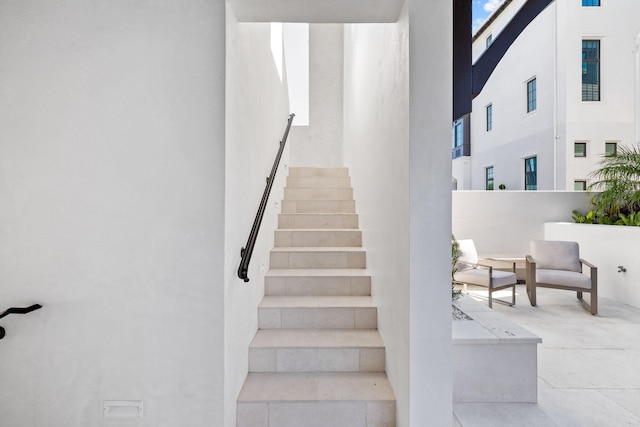 stairway with a towering ceiling