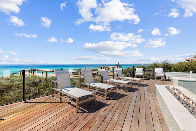 wooden deck with a water view