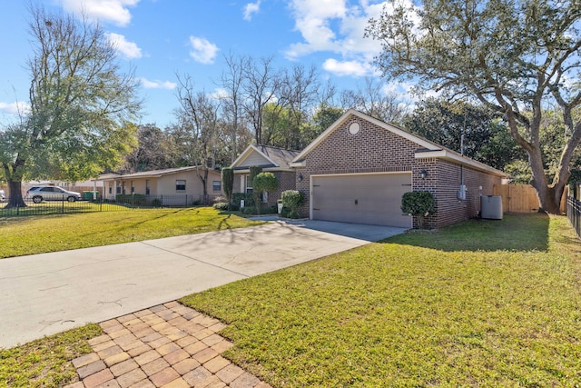 ranch-style home featuring a front lawn, driveway, a garage, brick siding, and fence private yard