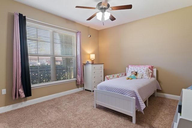 bedroom with baseboards, a ceiling fan, and carpet flooring