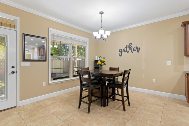 dining space featuring baseboards and ornamental molding