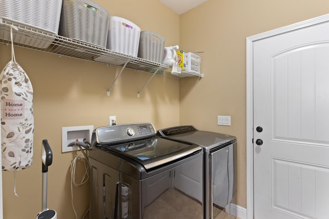 laundry room with washer and dryer and laundry area