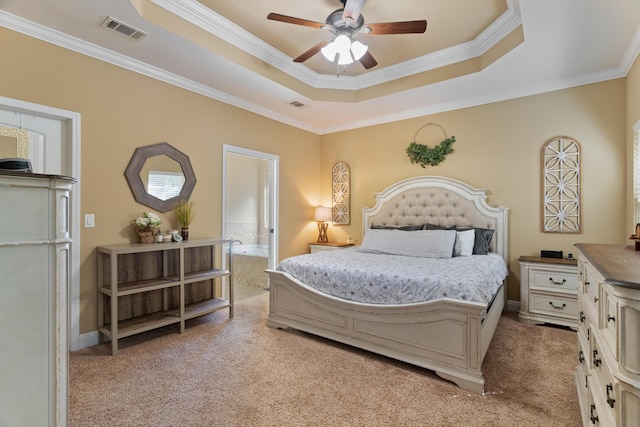 bedroom featuring visible vents, a raised ceiling, and light colored carpet