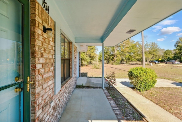 view of patio featuring a porch