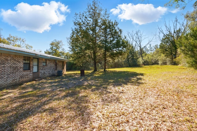 view of yard featuring central AC unit