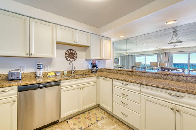 kitchen featuring a sink, stone countertops, and stainless steel dishwasher