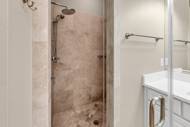 bathroom featuring vanity and a shower stall